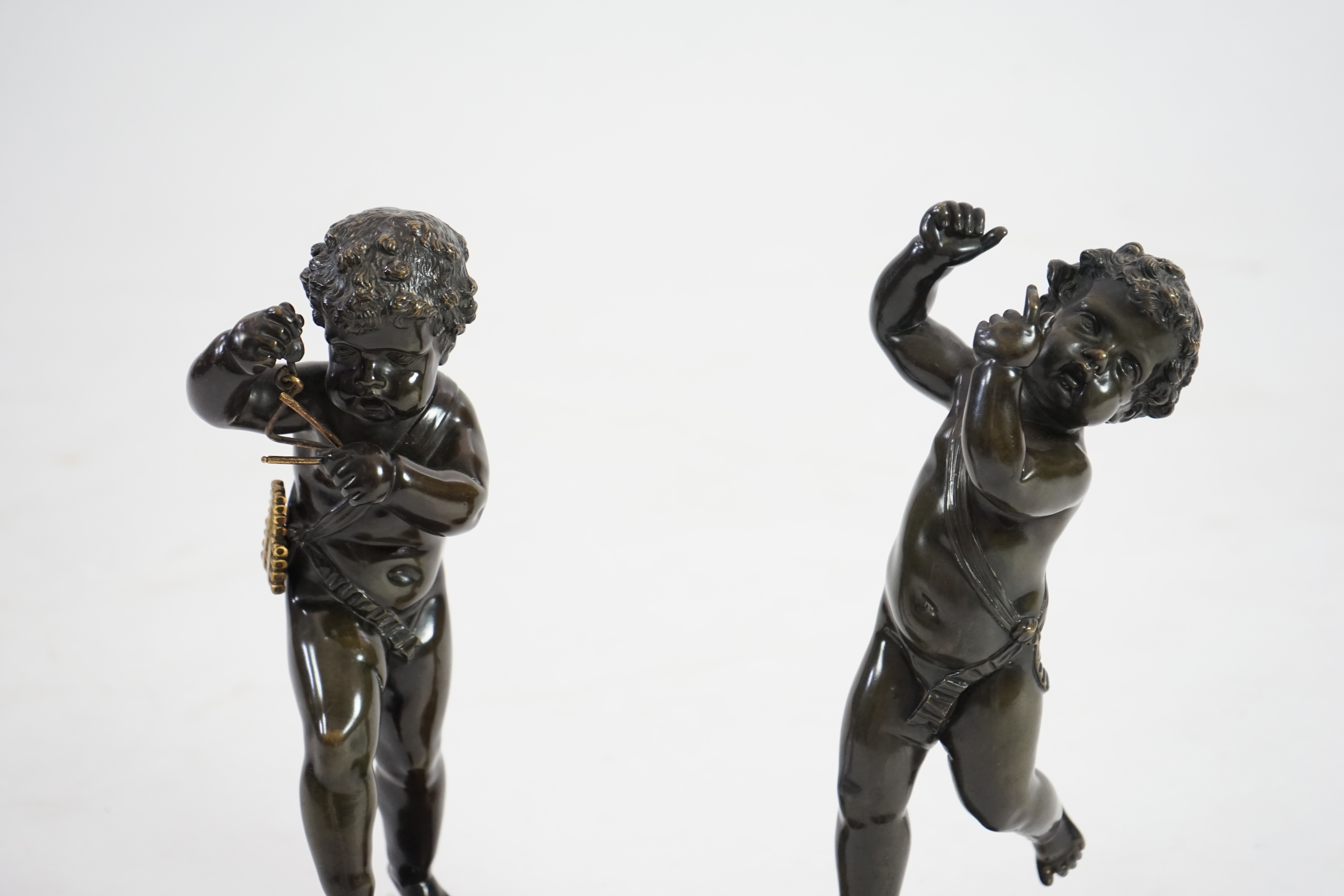 After Claude Michel Clodion (French, 1738-1814), a pair of late 19th century bronze figures of musical putti